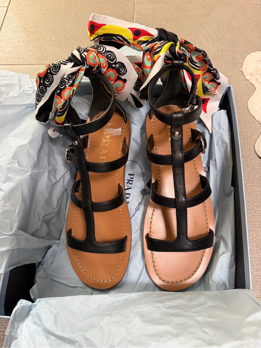 Prada Black Leather T-Strap Sandals with Multicolor Scarf Accent